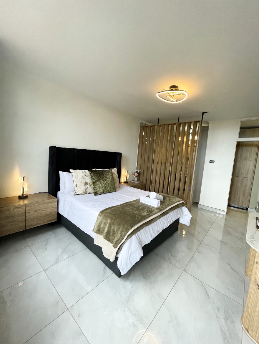 Main bedroom prepared for guest arrival at an EZStay managed Durban apartment